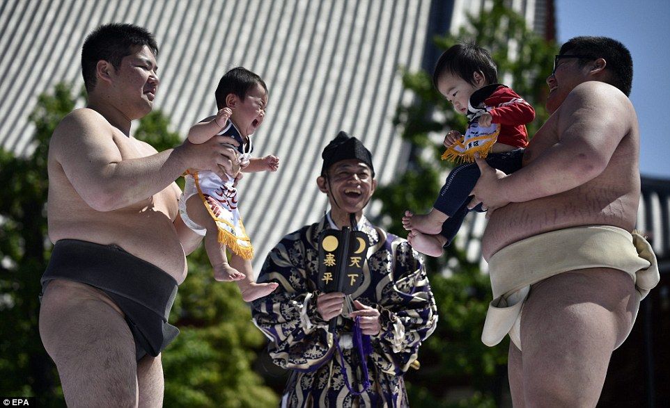 In Japan, letting a sumo wrestler make your baby cry is said to bring good health as well as warding off evil spirits.